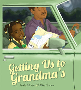  Cover: Getting Us to Grandma’s. By Nadia L. Hohn and TeMika Grooms. A young girl sits in the front passenger seat of a green car next to her dad in the driver’s seat. The girl has dark brown hair in braids with barrettes, and medium-dark skin tone. She smiles while holding a road map with the words “New York State Map” on it. Her dad has medium skin tone, short dark brown hair and a mustache. 