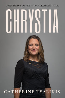  Upper body photograph of Chrystia Freeland standing in front of a grey background, facing the camera, with her arms by her side, smiling slightly. She has a light skin tone and dark blonde hair. She is wearing a black dress with a round neckline and three-quarter-length sleeves. A short double-string of pearls is just visible at the neckline. The title of the book, Chrystia: From Peace River to Parliament Hill is above the photograph and the author’s name, Catherine Tsalikis, is at the bottom of the cover. 