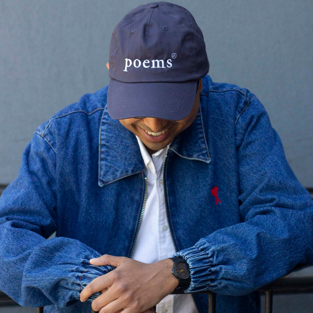  Photo: A navy cotton ball cap with 