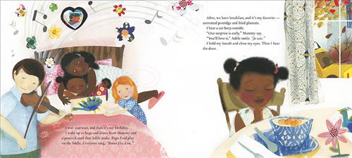  This image is a double page spread. To the left, a man and a girl with light skin tone, and a woman with dark skin tone are by a bed. In the bed is a girl with dark skin tone. The girl by the bed holds artwork. The text says it is the girl’s birthday. She wakes up to hugs and kisses. Her father plays the fiddle. To the right, a girl with dark skin tone is at a table with a bowl of food. The text says they have a breakfast of cornmeal porridge and fried plantain. They prepare the girl for a surprise. 