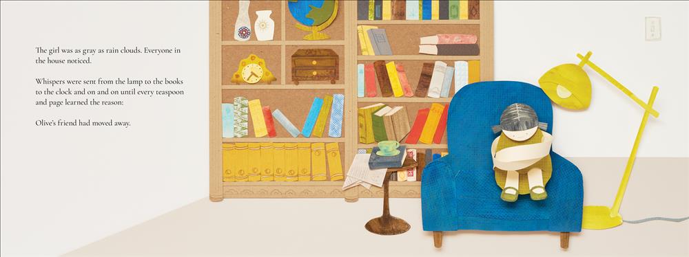  A girl with light skin tone, wearing a green dress, sits on a blue armchair with her arms wrapped around her knees. Behind her is a bookshelf. There is a side table with a cup of tea to the left of the chair, and a yellow lamp leans toward her on the right. Text: The girl was as gray as rain clouds. Everyone in the house noticed. Whispers were sent from the lamp to the books to the clock and on and on until every teaspoon and page learned the reason: Olive’s friend had moved away. 