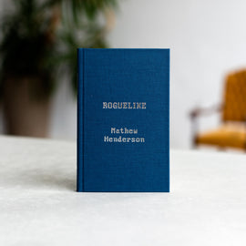  The cover image resembles the digital space of a retro video game. The background is black with pixilated grey pathways leading to small brown squares. Inside the squares are green dots and small pixelized images. Text: Roguelike. Poems. Mathew Henderson. 